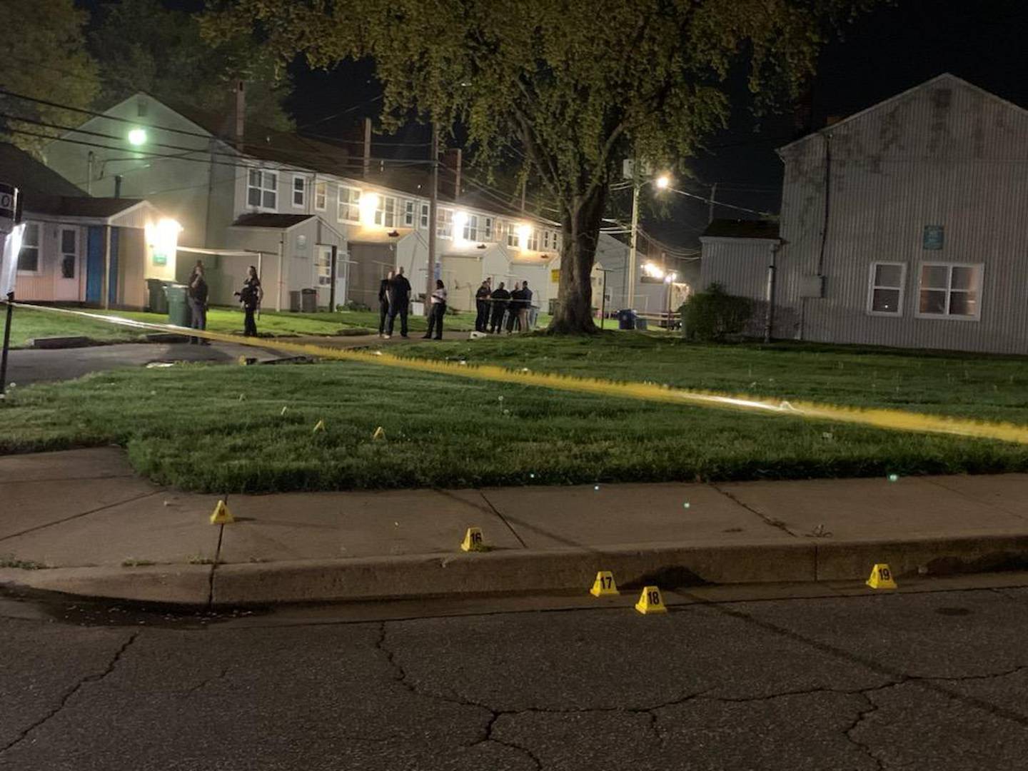 Evidence markers are placed at a shooting scene in the 2400 block of Maisel Court on Saturday, April 15.