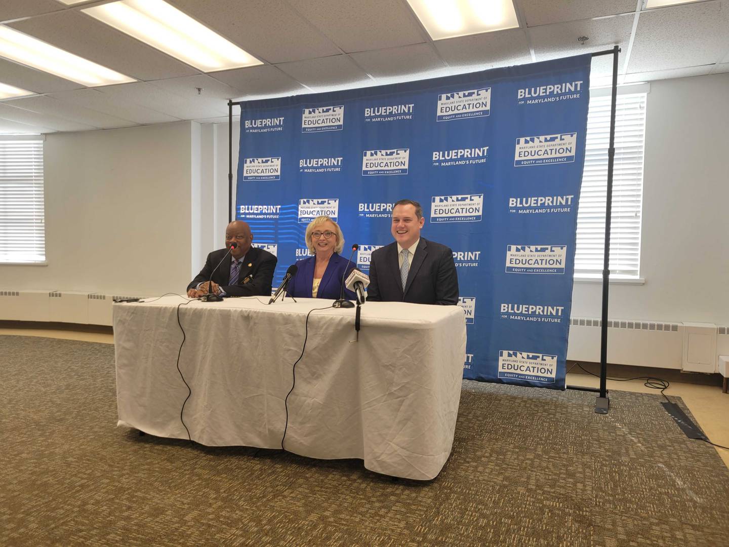 Clarence Crawford, president of the Maryland State Board of Education, sits with the new interim superintendent of Maryland Public Schools Carey Wright and Josh Michael, vice president of the board, at a news conference on Thursday.