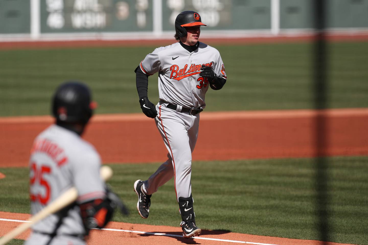 BOSTON, MASSACHUSETTS - MARCH 30: Adley Rutschman #35 of the Baltimore Orioles rounds the bases after hitting a home run during the first inning against the Boston Red Sox on Opening Day at Fenway Park on March 30, 2023 in Boston, Massachusetts.