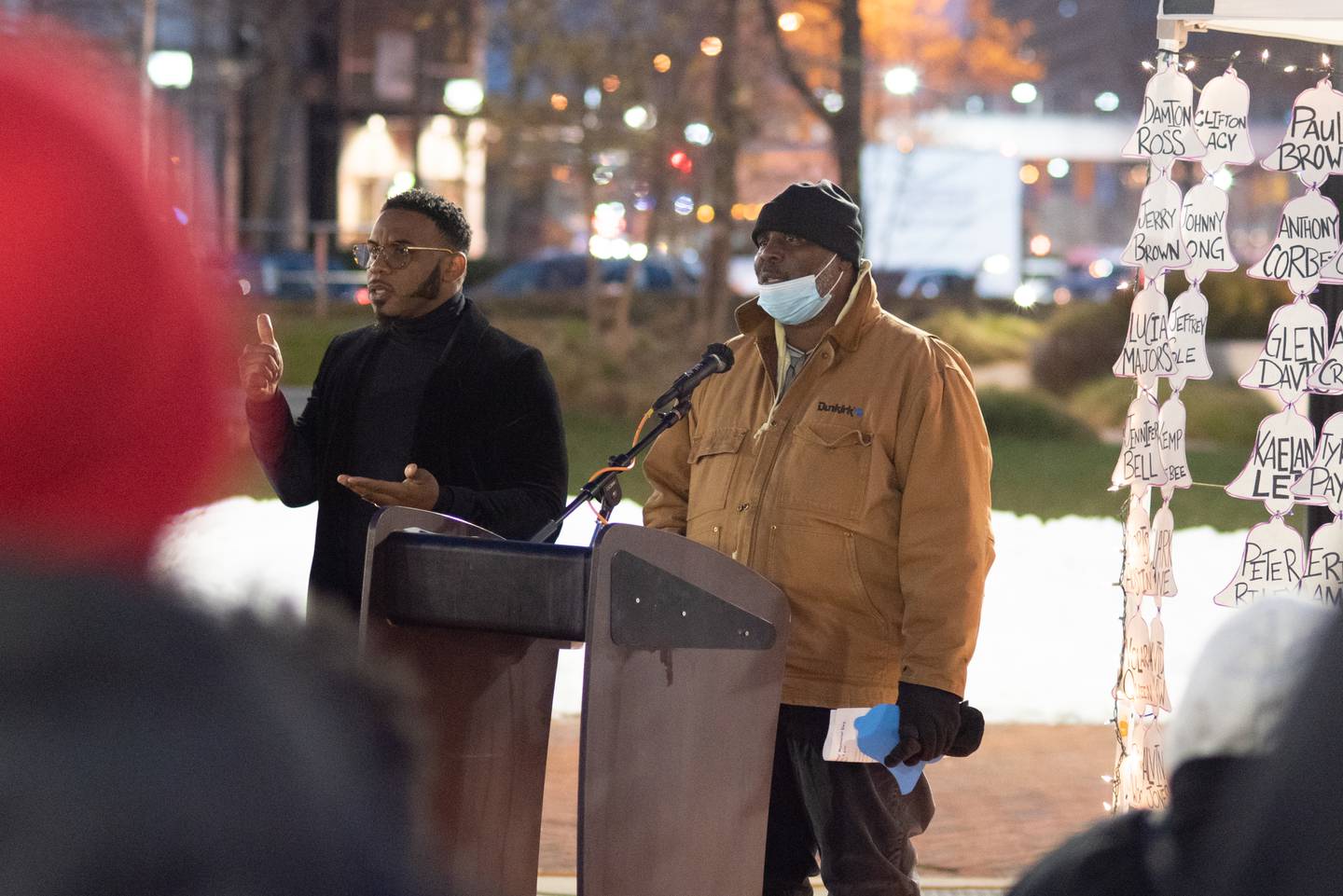 Mark Council, right, is accompanied by an ASL interpreter as he welcomes attendees to the 2nd annual Homeless Persons' Memorial Day service at McKeldin Square in Downtown Baltimore. Council is on the Healthcare for the Homeless board of directors.