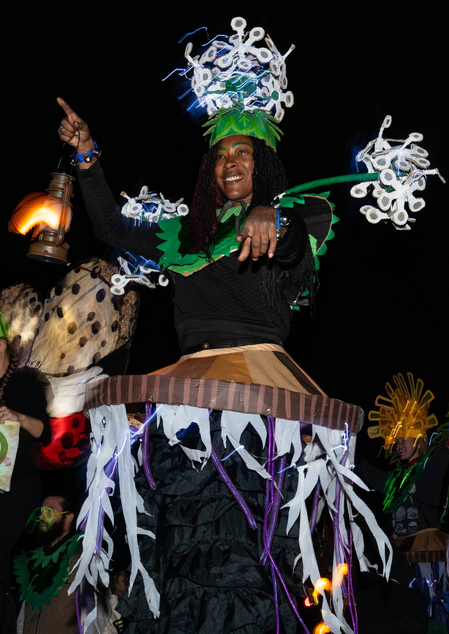 A dancer performs during The Great Halloween Lantern Parade at Patterson Park on Saturday, Oct. 21, 2023.