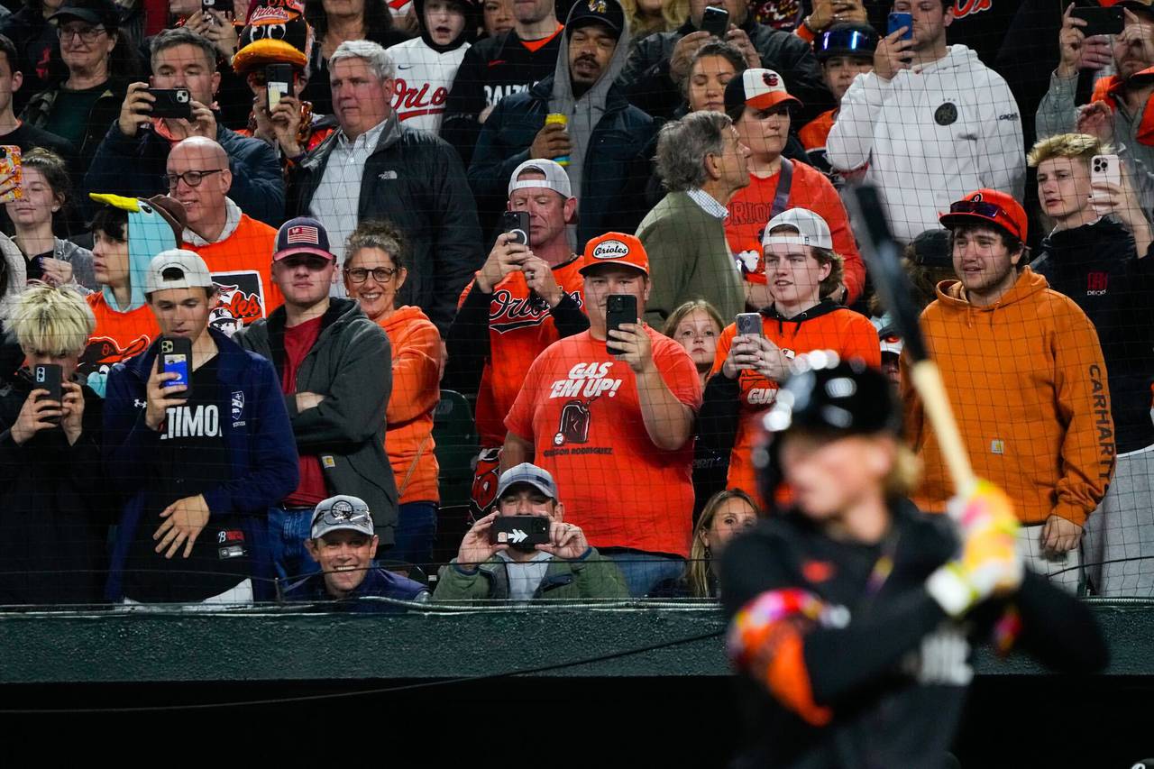 Fans and Camden Yards document the moment during the Baltimore debut of top prospect Jackson Holliday on April 12, 2024.