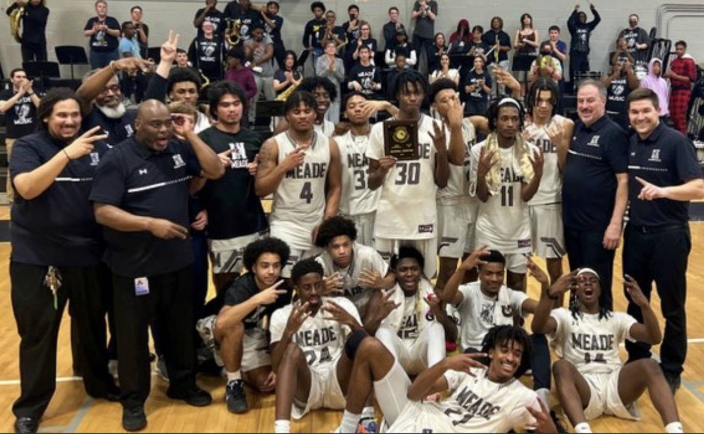 Meade High's boys basketball team repeated as Class 4A East Region I champions Thursday. The Mustangs converted 17-of-21 free throws in the fourth quarter to hold off Reservoir.