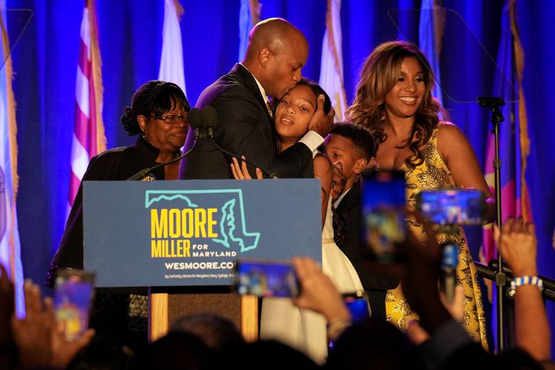 Democratic gubernatorial candidate Wes Moore celebrates with his family after declaring victory at an Election Night event at the Baltimore Marriott Waterfront on Tuesday, November 8. Democratic candidates Wes Moore, Aruna Miller, Chris Van Hollen, Anthony Brown and Brooke Lierman held a combined event beginning at 8 p.m. as the polls closed.