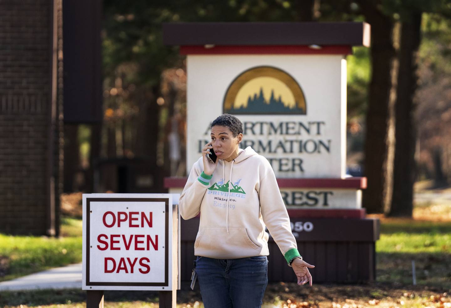 Sharnae Hunt talks on the phone and watches as haulers put her belongs back onto a truck after she was wrongfully evicted at one of the five Glen Burnie apartment communities that makeup the Hendersen Webb, Inc.-owned The Forest on November 22, 2022.