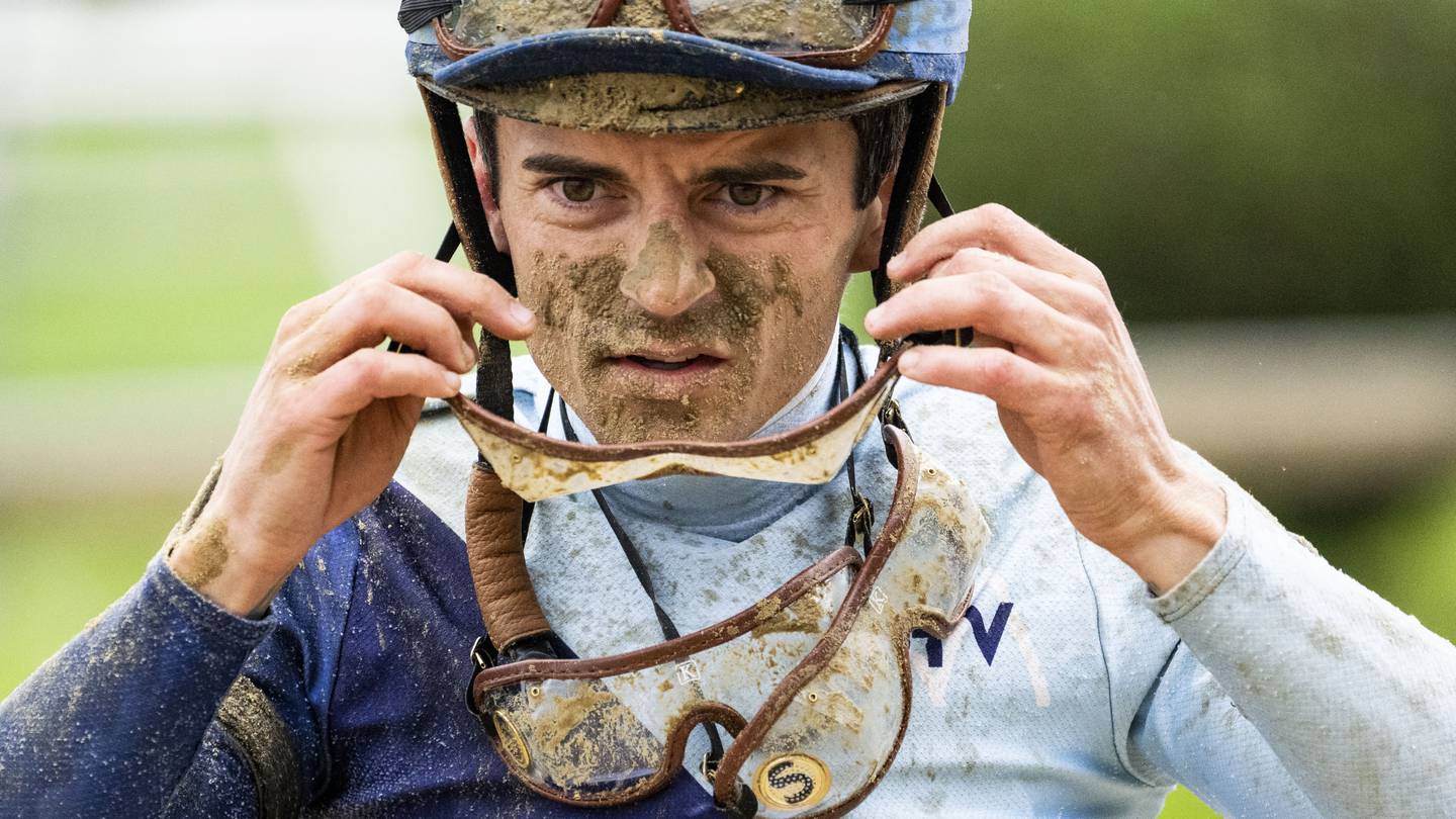 Jockey Sheldon Russell heads back to the stables after competing in the first race of the day during Preakness at Pimlico Race Course in Baltimore on May 18, 2024.