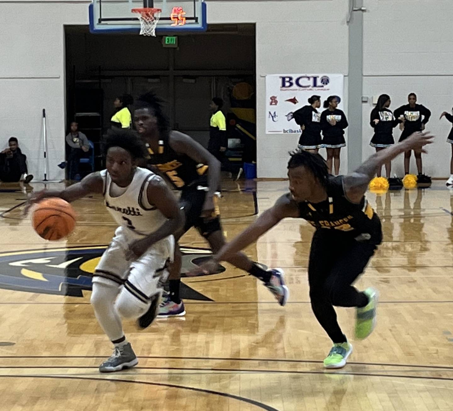 Goretti's Jahsan Johnson drives to the basket as St. Frances' Kamauri Lawson pursues during the second half of Saturday night's Baltimore Catholic League Tournament semifinal. Johnson scored 29 points as Goretti ended the top-ranked Panthers' season with a 68-62 decision at Goucher College.
