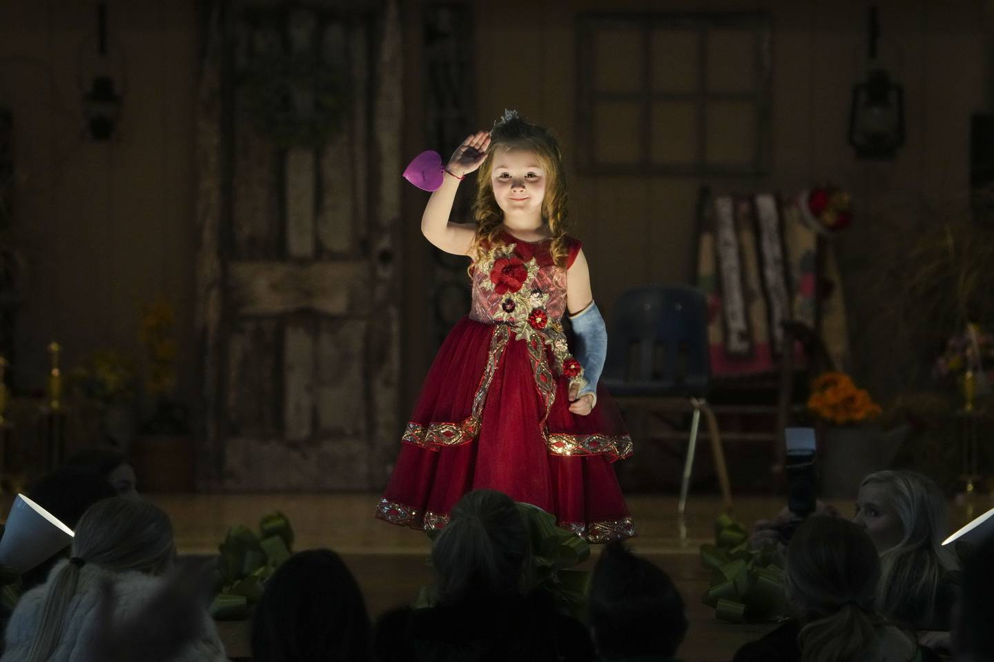 Rose Bloodsworth, 5, participates in the Little Miss Outdoors pageant with a broken arm.