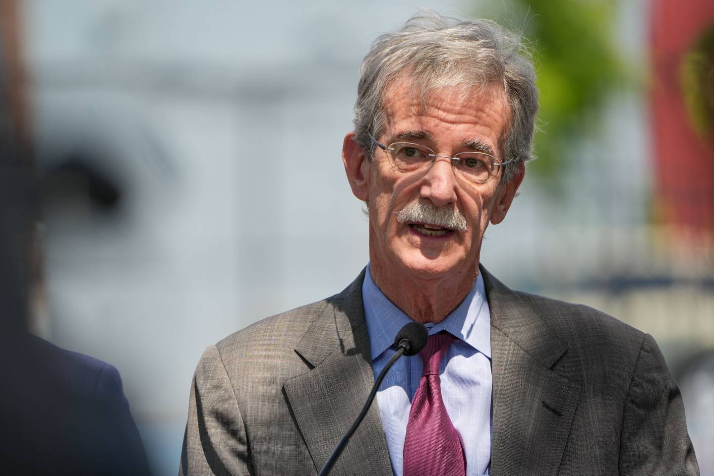 Maryland Attorney General Brian Frosh speaks at a press conference outside Tench Tilghman Elementary/Middle School to highlight resources and initiatives meant to reduce violent crime in Baltimore on 8/24/22.