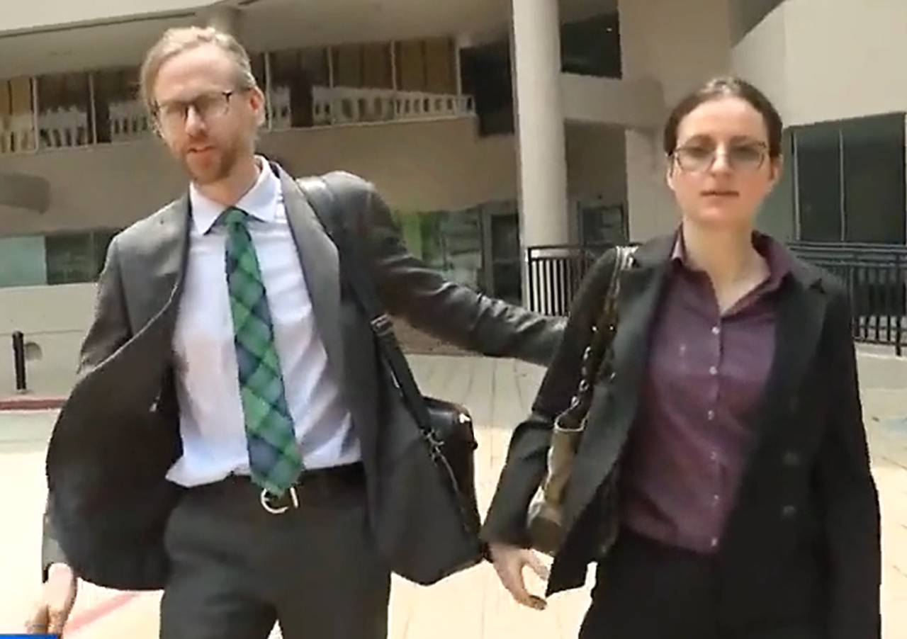 Anna Gabrielian, a former anesthesiologist at Johns Hopkins Hospital, and her spouse, U.S. Army Maj. Jamie Lee Henry, walk into the Edward A. Garmatz U.S. Courthouse in Baltimore on Tuesday, May 23, 2023.
