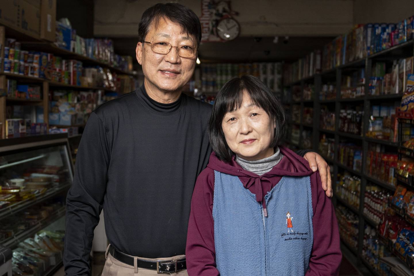 Kevin Lee and Tae Soon Lee pose for a portrait at Lee's Mini Market, in Baltimore, Thursday, December 1, 2022.