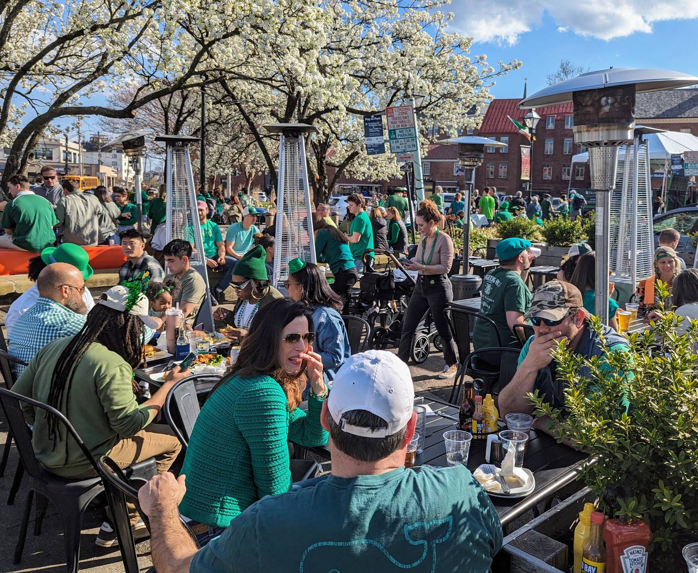 Tables at Market Space in Annapolis, operated by five downtown restaurants, were filled with people celebrating St. Patrick's Day on March 17, 2024.