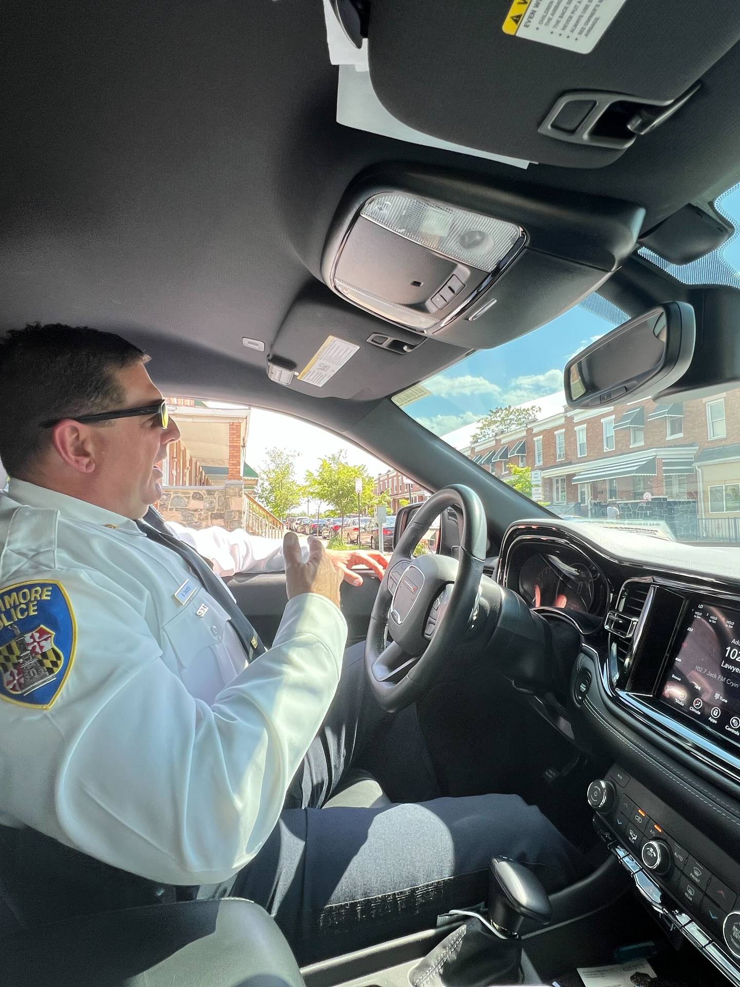 Eastern District Maj. Guy Thacker sits in his vehicle keeping an eye on the corner of North Potomac and East Preston streets, where he says there is concern about the potential for violence. Police no longer "clear corners," but do approach or keep an eye on people clustering in areas of concern. Residents say it's harassment.