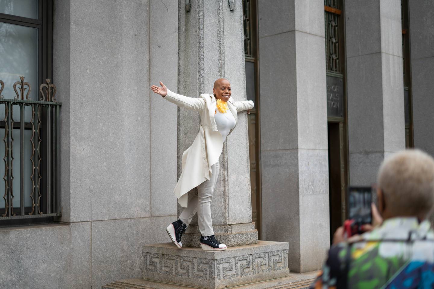 Monique Smith showing excitement after arriving to the Office of Vital Records in New York City, New York, April 26, 2022.