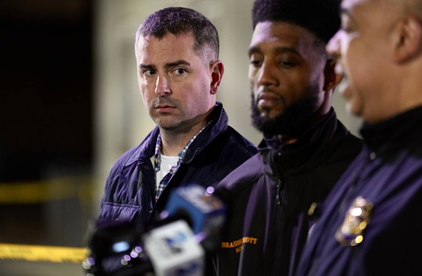 Mayor Brandon Scott, Councilman Eric Costello and Police Commissioner Michael Harrison hold a press conference after a mass shooting at the intersection of Pennsylvania Avenue and Laurens Street in Upton on January 28, 2023.