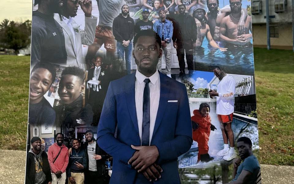 A photo collage of Jalil George, 24, is displayed at a vigil in his memory held at the Western School of Technology in Catonsville on December 10, 2022. George was fatally shot while visiting his investment property in Park Heights after he was apparently misidentified.