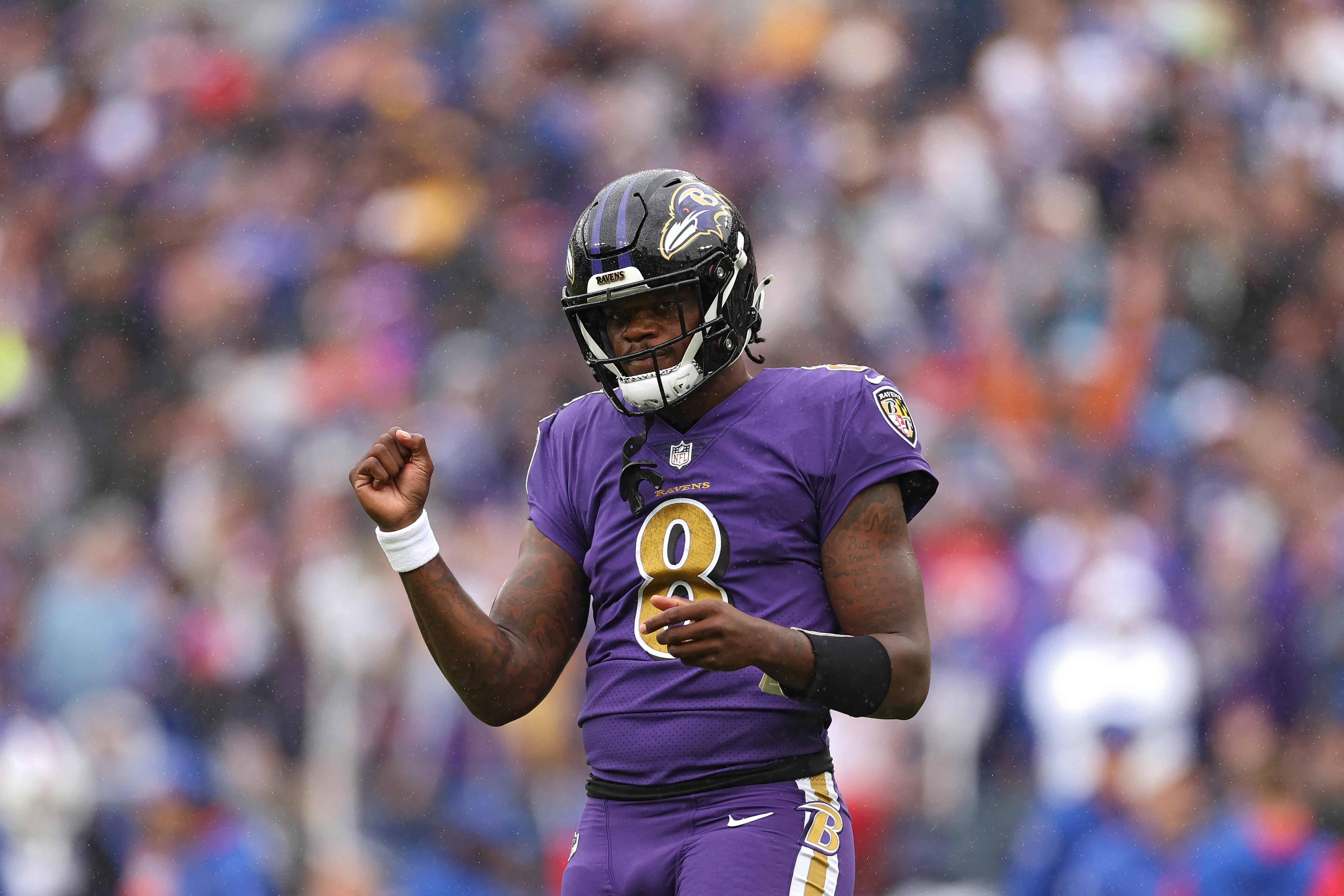 BALTIMORE, MARYLAND - OCTOBER 02: Quarterback Lamar Jackson #8 of the Baltimore Ravens celebrates after teammate J.K. Dobbins #27 scored a touchdown in the first quarter against the Buffalo Bills at M&T Bank Stadium on October 02, 2022 in Baltimore, Maryland.
