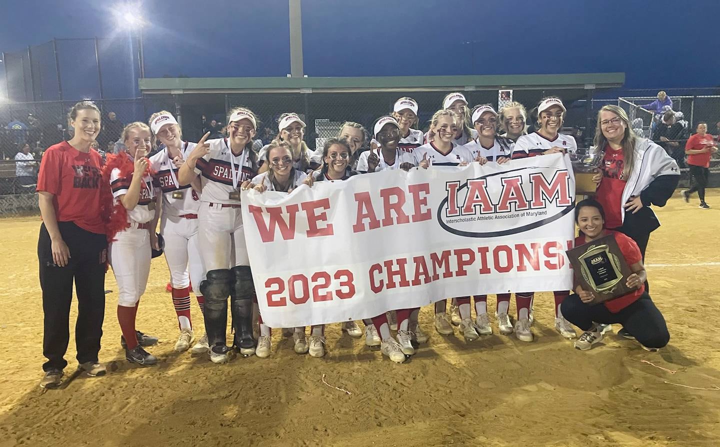 The banner says it all. Archbishop Spalding celebrated its victory in the IAAM A Conference softball championship game with a team photo following its 6-3 win over John Carroll, Tuesday evening at Bachman Park.