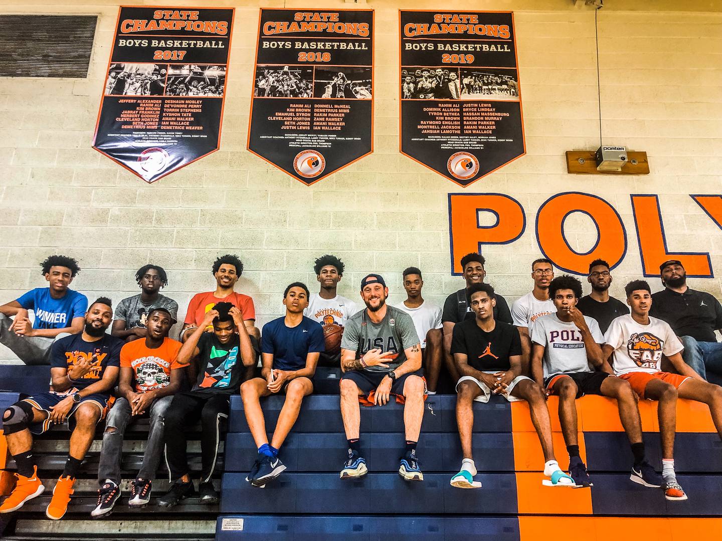 Sam Brand with one of his teams at Baltimore Polytechnic Institute.