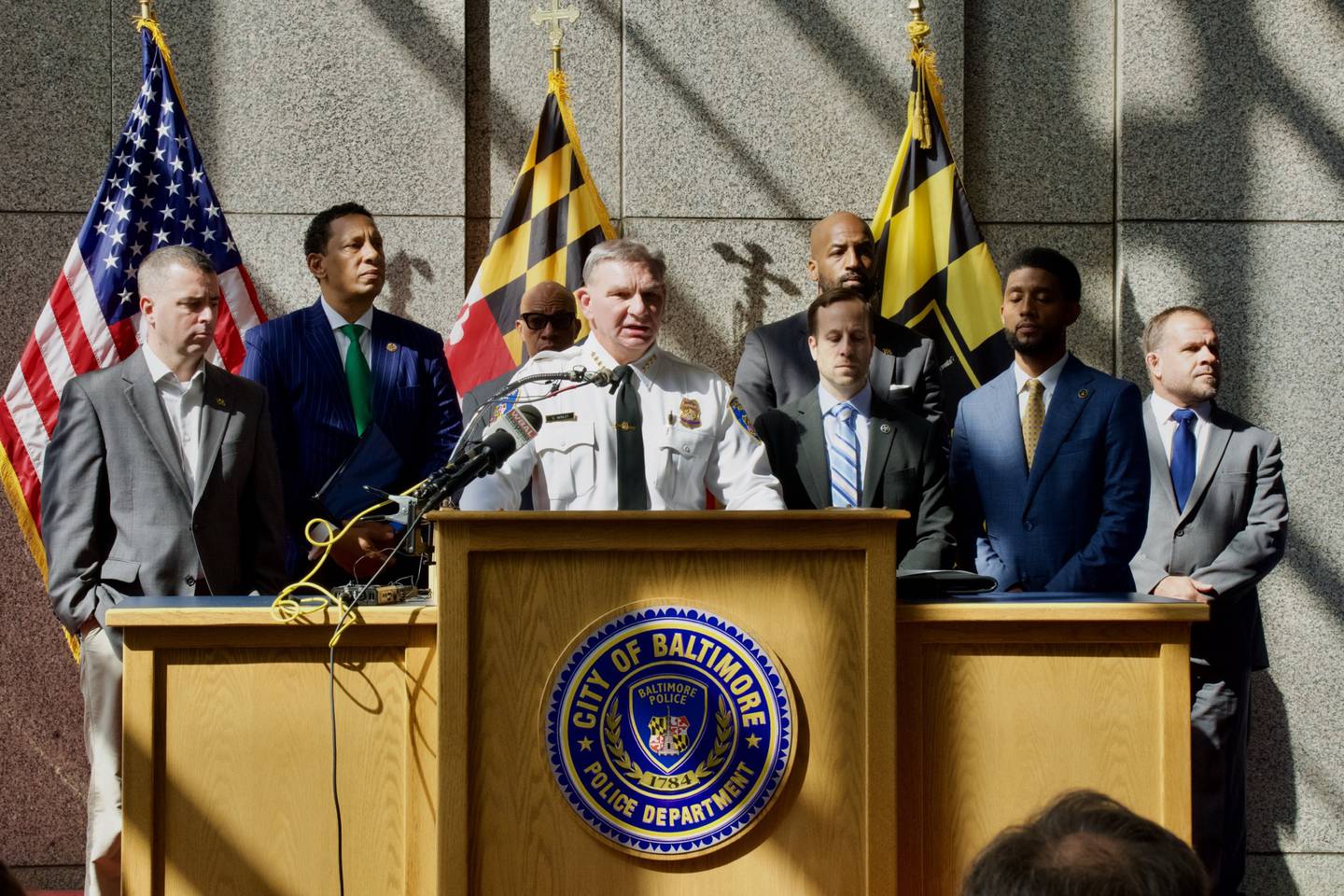 Baltimore acting Police Commissioner Richard Worley, U.S. Marshals Chief Deputy Mathew Silverman, Baltimore Mayor Brandon M. Scott, and Baltimore City State's Attorney Ivan J. Bates host a press conference at police headquarters on the arrest of Jason Billingsley, the suspect in the killing of Pava LaPere, on Sept. 28, 2023. Billingsley was apprehended at a train station in Bowie late last night. (Kaitlin Newman/The Baltimore Banner)