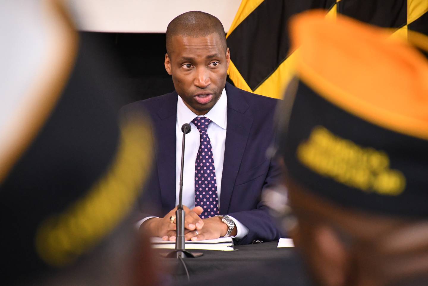 Anthony Woods, Gov. Wes Moore's nominee for secretary of veterans affairs, listens during an event at the State House in Annapolis with military veterans.