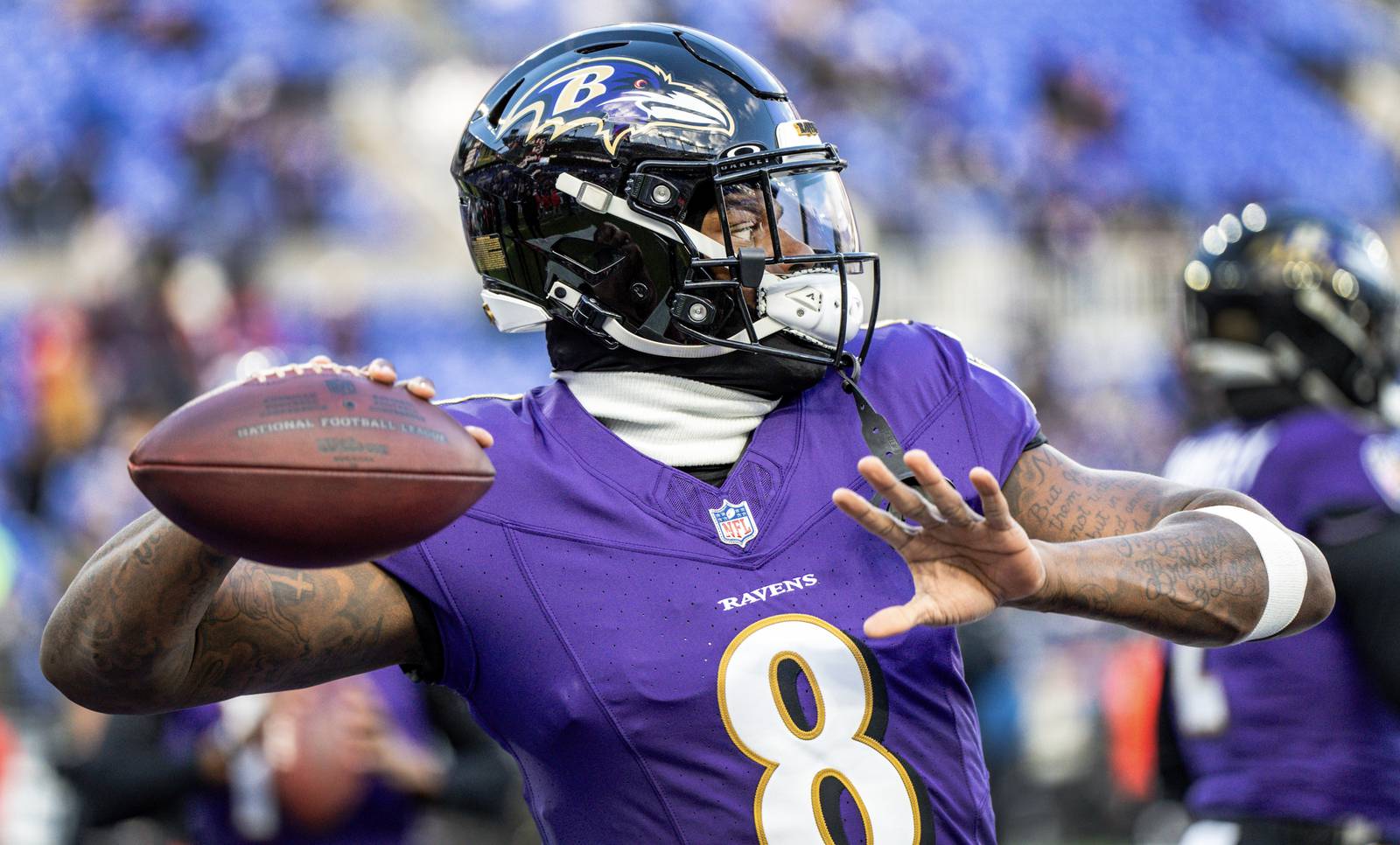 Baltimore Ravens quarterback Lamar Jackson (8) warms up before the game against the Houston Texans at M&T Bank Stadium on Saturday, Jan. 20, 2024.