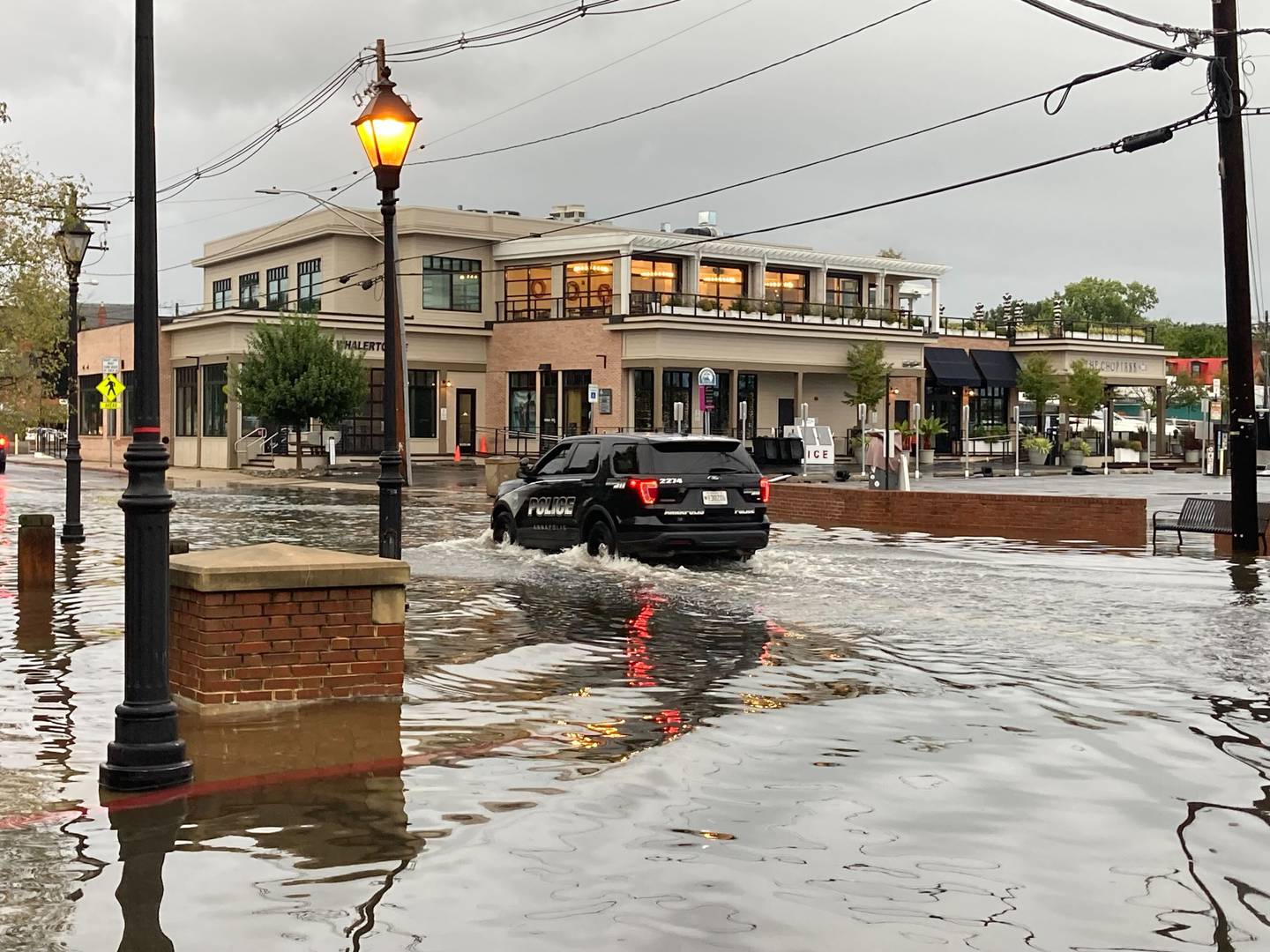 Flooding in downtown Annapolis Sunday morning as a result of the remains of the storm that was once known as Tropical Storm Ophelia. An Annapolis Police vehicle rides through floodwaters on Compromise Street.
