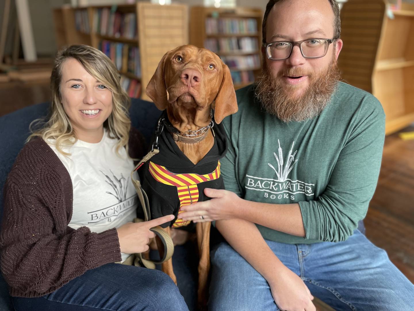 Alli and Matt Krist with their dog, Chomsky.  The couple is opening Backwater Books, a bar and bookstore on Ellicott City's Main Street.