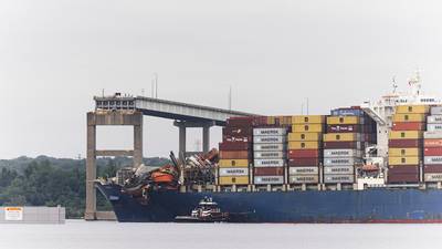 Dali cargo ship docks in Baltimore after being moved from Key Bridge wreckage