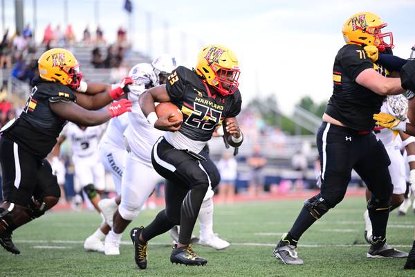 Team Maryland running back Bryce Cox looks for running room during Sunday's Big 33 Classic. The recent Mount St. Joseph scored two touchdowns and was named team MVP as Maryland fell late to Pennsylvania, 31-27, at Bishop McDevitt in Harrisburg, Pa.