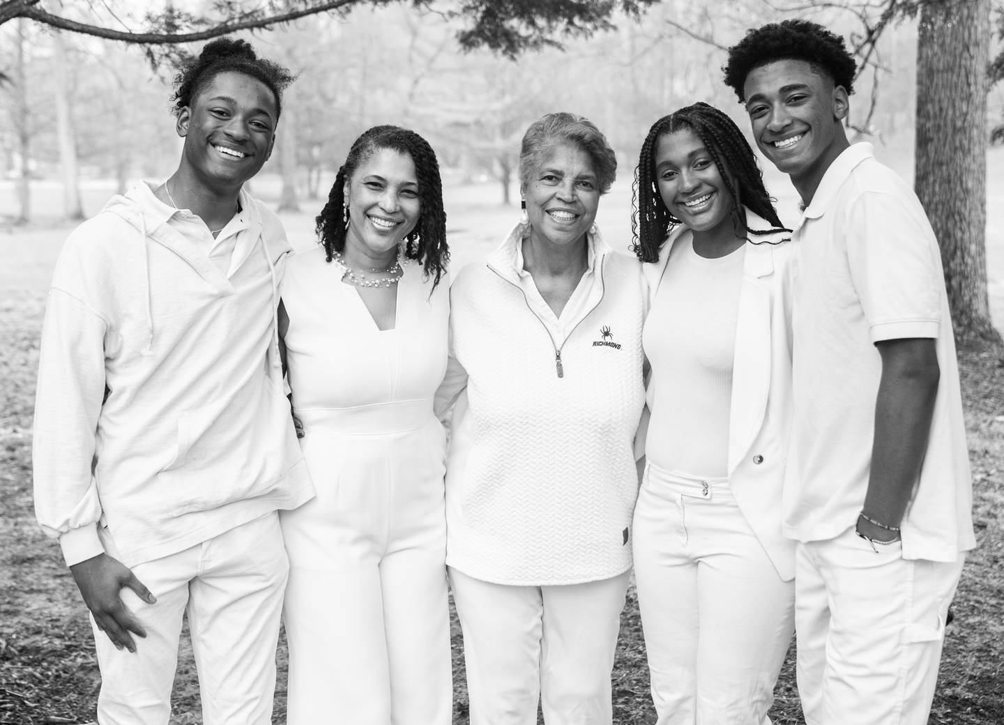 Kai Hammond, Dr. Camille Hammond, Dr. Tinina Cade, Simone Hammond and Aaron Hammond all poses together for a portrait outside their home in Reisterstown, March 25, 2023.