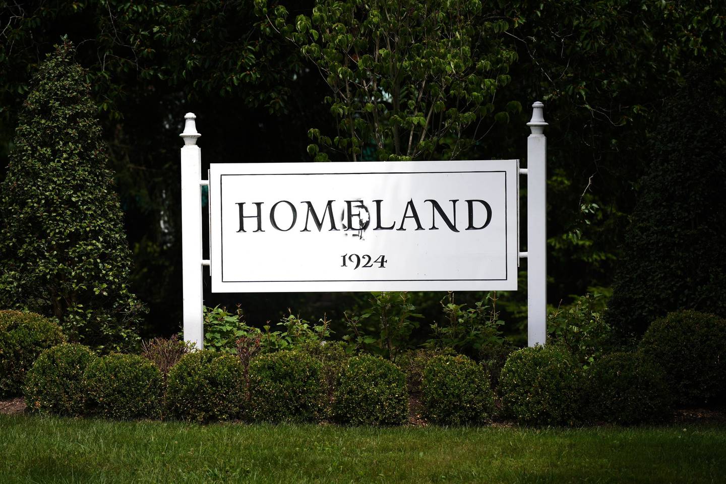 The Homeland sign near Loyola University, defaced with a slur at some point following the 2023 Baltimore Pride Parade on June 24, was temporarily patched up by the following afternoon.