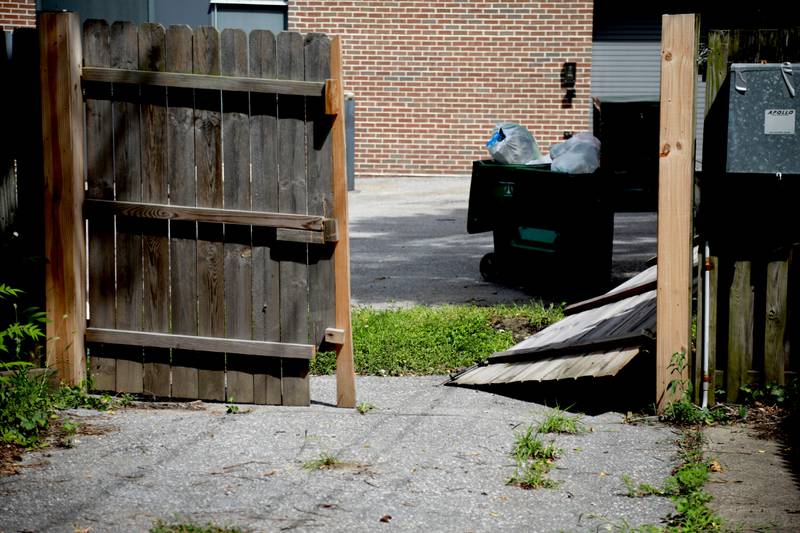 Records show a Baltimore nonprofit housing provider stopped paying tenants’ rents and hasn’t accounted for the money. Broken gate to the courtyard in the rear.