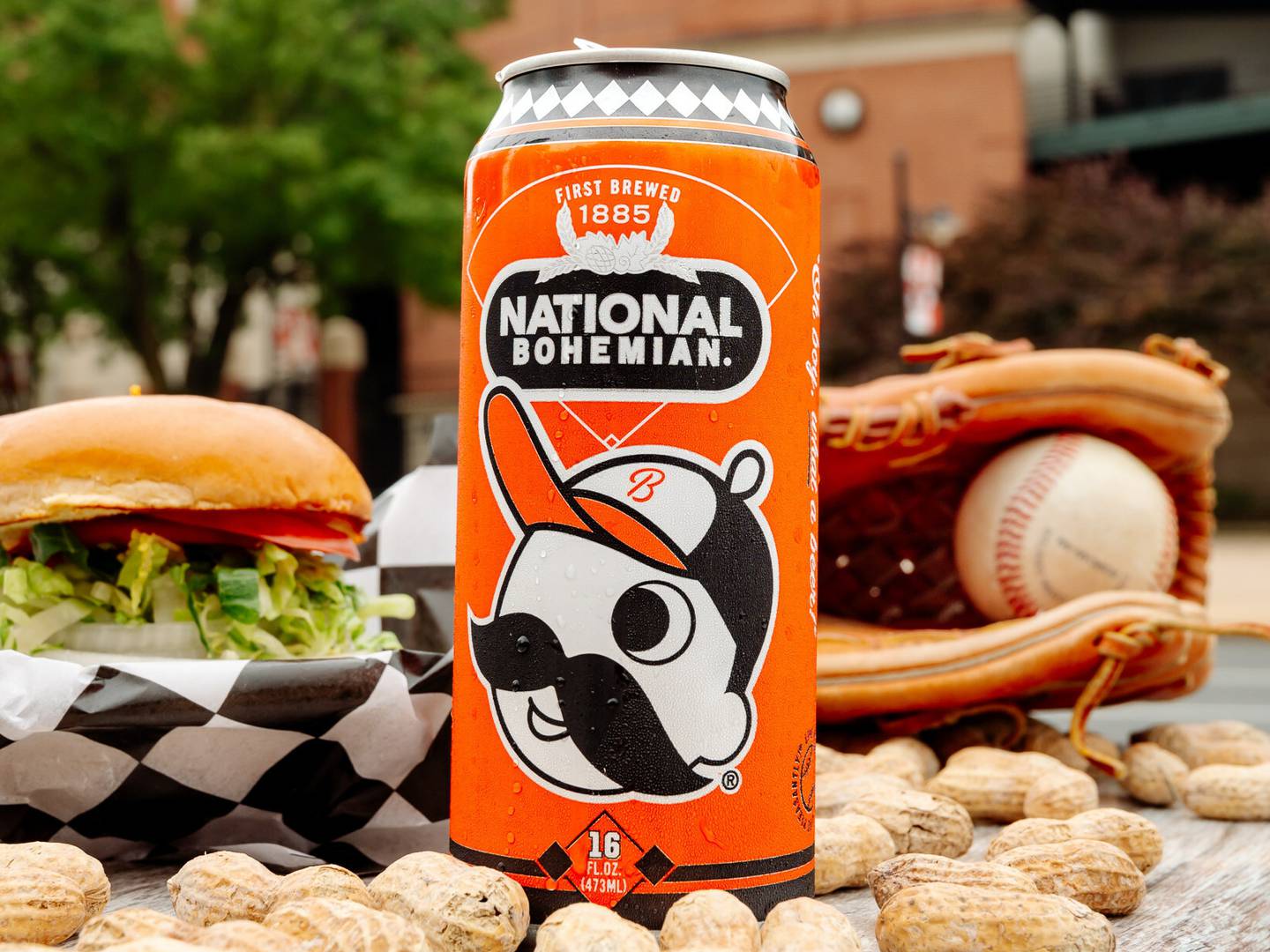 A can of National Bohemian beer sits among peanuts outside the home plate entrance of Oriole Park at Camden Yards.