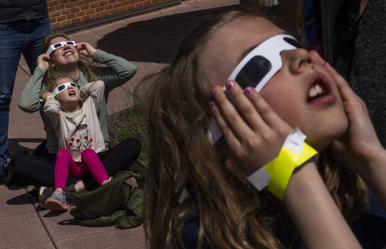 Hillary Heckwolf and daughter Chole, 5, get excited to see the rare solar eclipse.