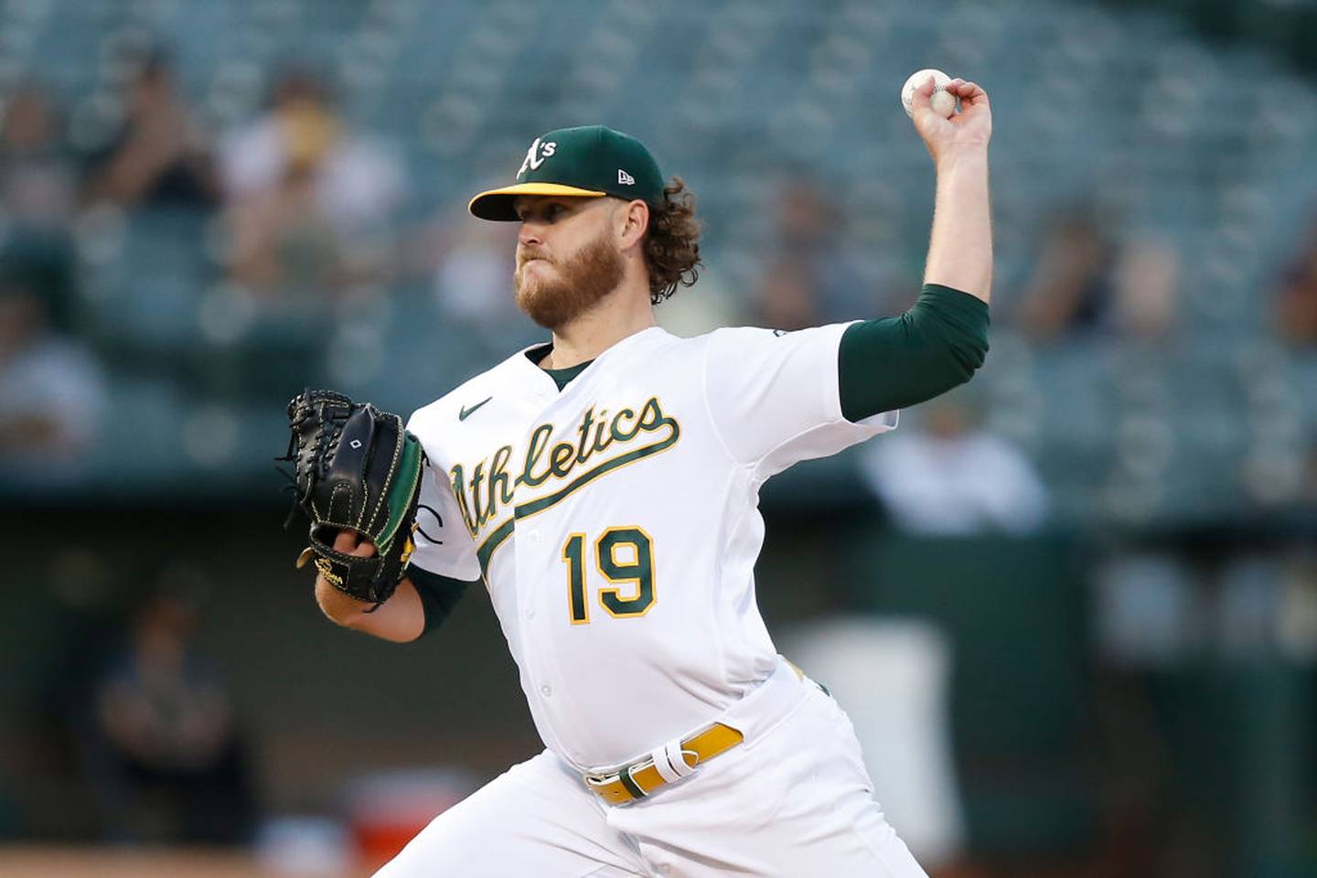 OAKLAND, CALIFORNIA - SEPTEMBER 06: Cole Irvin #19 of the Oakland Athletics pitches in the top of the first inning against the Atlanta Braves at RingCentral Coliseum on September 06, 2022 in Oakland, California.