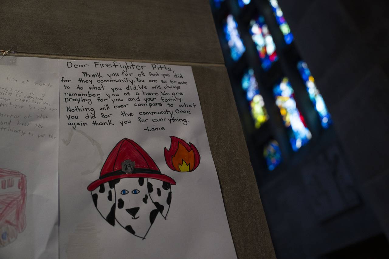 Children of the school of Our Mary Our Queen made love letters to Baltimore City firefighter Rodney Pitts and they hung on the pillars inside the cathedral during his memorial service on October 26. 2023 .