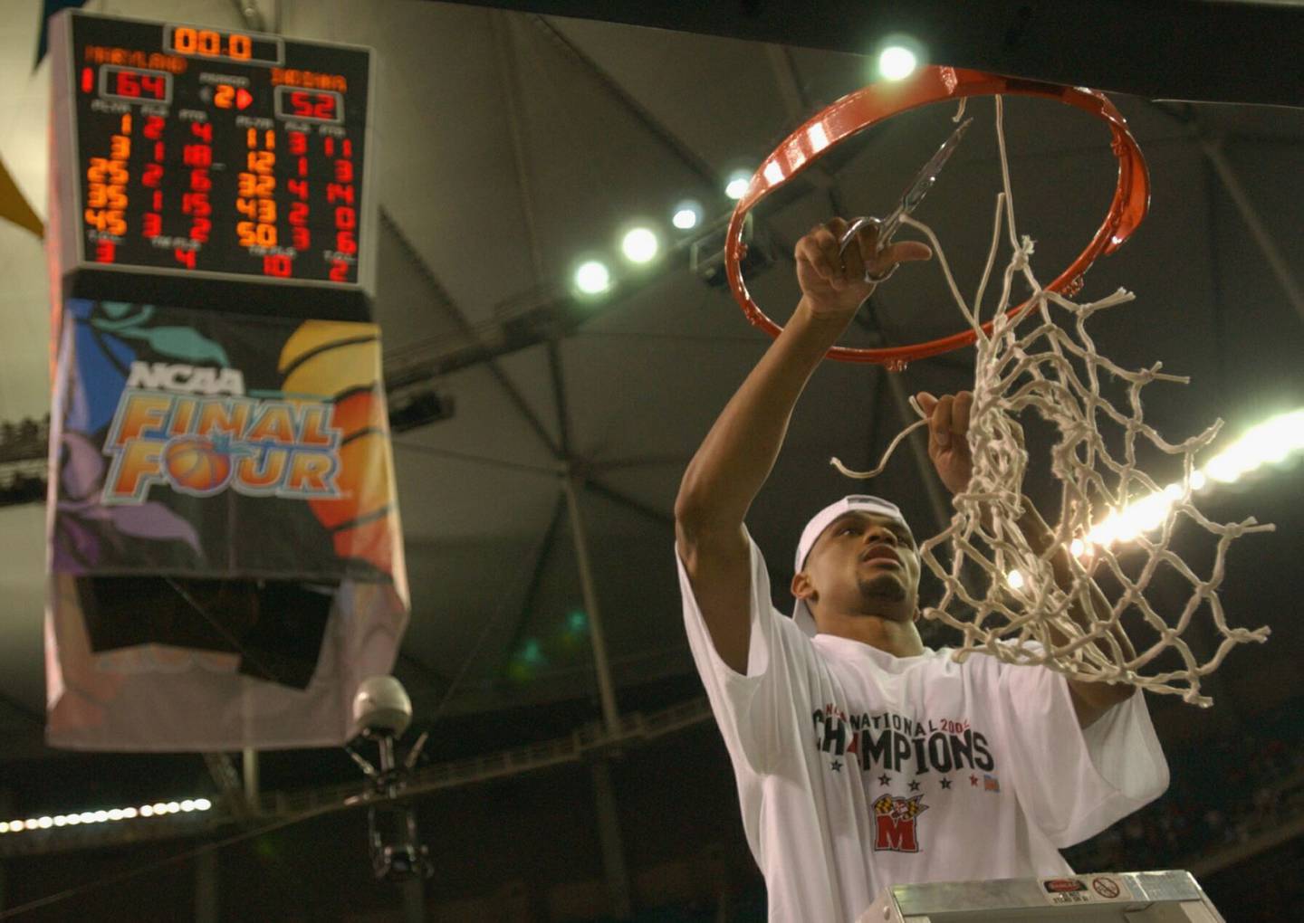 ATLANTA, GA - APRIL 1:  Juan Dixon #3 of the University of Maryland Terrapins celebrates by cutting down the net after the men's NCAA National Championship game against the Indiana University Hoosiers at the Georgia Dome in Atlanta, Georgia on April 1, 2002.  Maryland defeated Indiana 64-52 winning the National Championship.