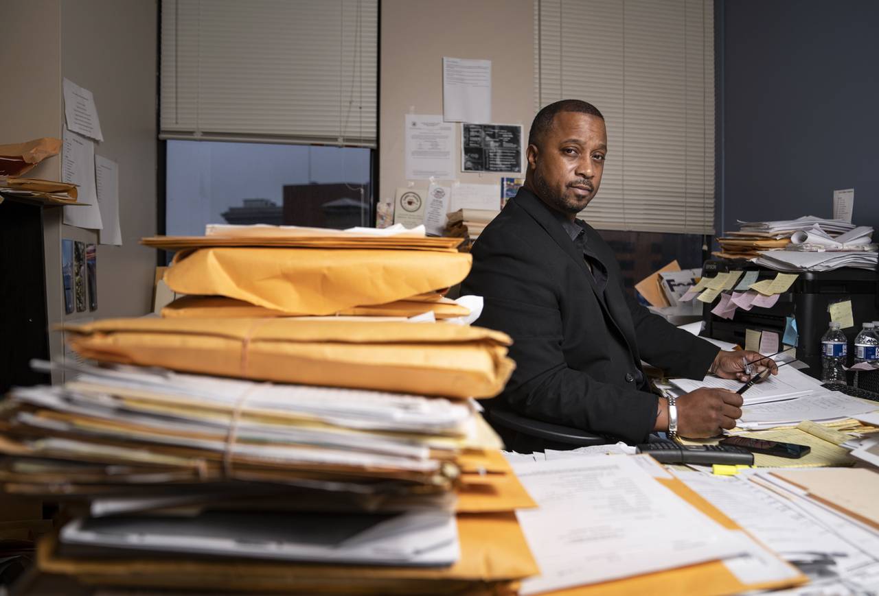 Corey Woodfolk, general manager at litigation specialist at Bates & Garcia LLC, poses for a portrait inside of his office in Baltimore, Thursday, December 15, 2022.