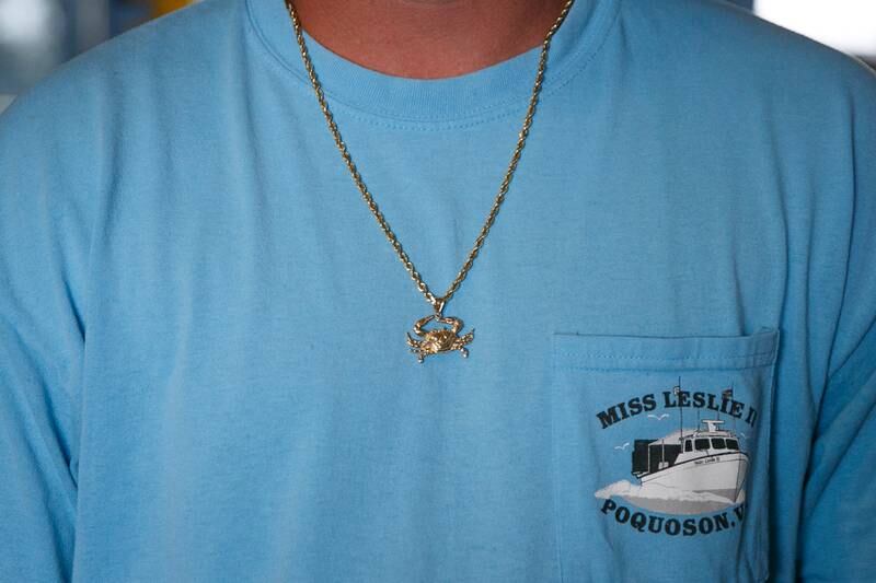 Jay Diggs proudly wears a crab chain and a t-shirt with his boat’s name, Miss Leslie II, before the start of a meeting withThe Crab Management Advisory Committee (CMAC) and VMRC to discuss potential management measures for the upcoming crabbing season at the VMRC Main Office in Fort Monroe, Va., on Wednesday, June 8, 2022. Diggs has been in the industry since 2005 and full-time since 2013.