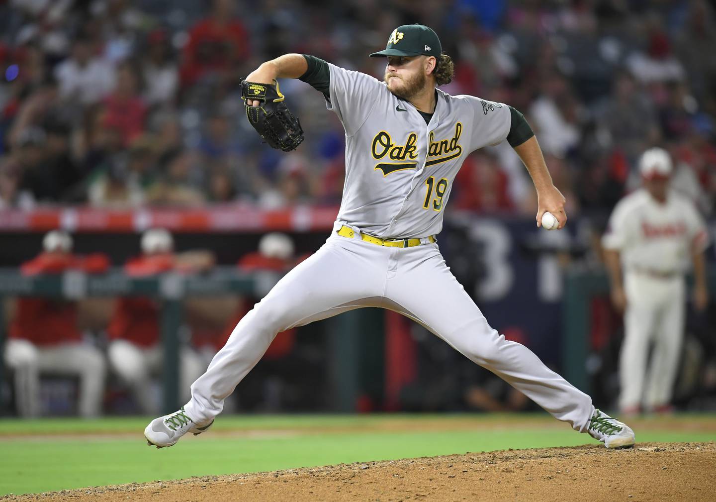 ANAHEIM, CA - AUGUST 02: Cole Irvin #19 of the Oakland Athletics pitches against the Oakland Athletics in the fifth inning at Angel Stadium of Anaheim on August 2, 2022 in Anaheim, California.