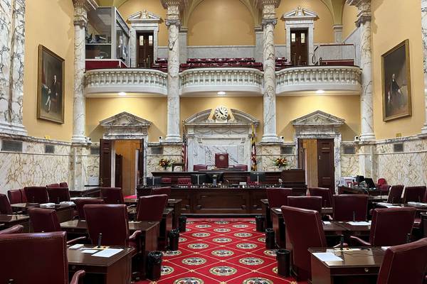 The Maryland Senate Chamber is decorated with the colors of the Maryland state flag.
