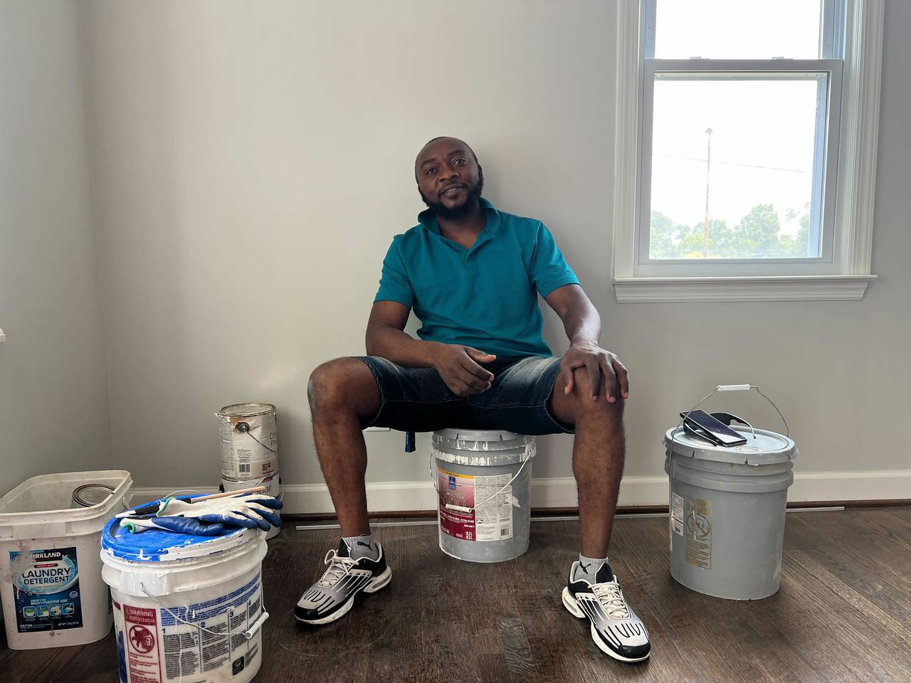Godlove Mancho, one of 10 Marylanders from Cameroon convicted of sending weapons to their home country, sits inside a home he's renovating in Capitol Heights. He's trying to get as much done as possible before he must report to federal prison.