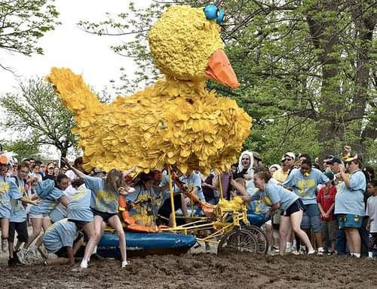 Daley the Duck is pushed through the mud pit, with author Kaitlin Newman is in the front to the left, about to slip and fall. (photo courtesy of Ian Macdonald via the KSR, May 2003)