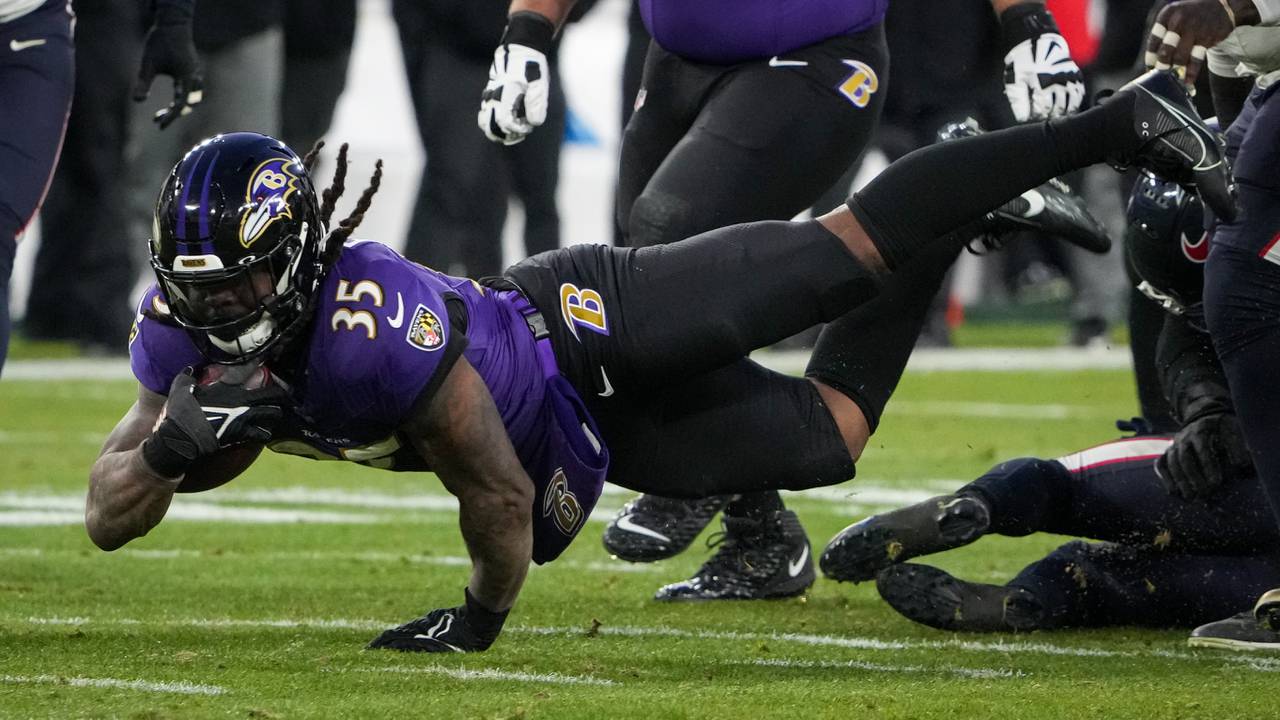 Baltimore Ravens running back Gus Edwards (35) rushes forward during a playoff game against the Houston Texans at M&T Bank Stadium on January 20, 2024.