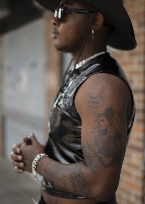 Breion Evans shows his tattoo during Trans Pride in Baltimore on June 3, 2023.