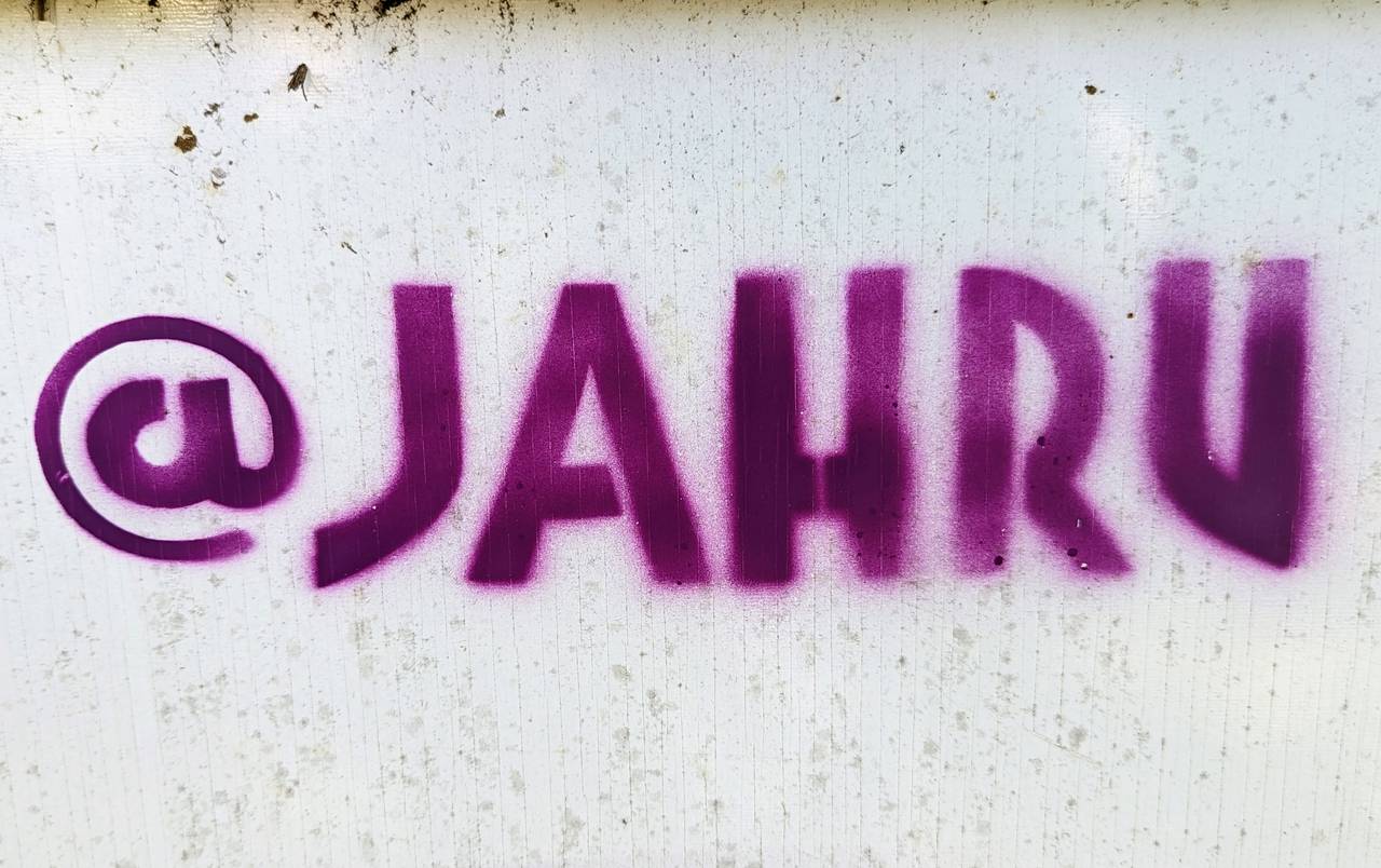 Jeff Huntington, who with his partner and wife Julia Gibb along with a youth street art group called Future History Now is responsible for a wide selection of Annapolis works, signs his art with @JAHRU.