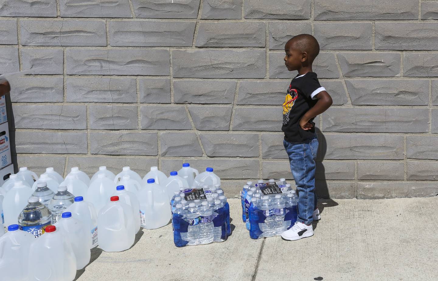 Bryson Mason, 3, does his part to help distribute water. Maryland Candidate for Governor Dan Cox stops in West Baltimore to distribute water to the communities affected by the E.coli scare. He was assisted by Maryland House of Delegrates candidate Zuleika Baysmore, District 40.