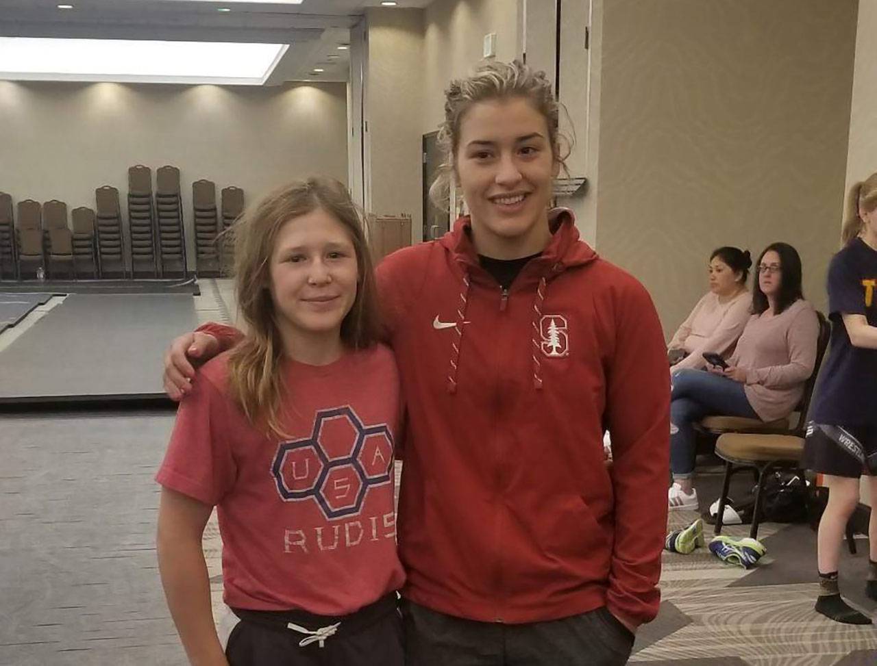 South River's 113-pound senior Alex Szkotnicki (left) was two years old in 2006 when Olympic champion Helen Maroulis (right) became the first girl to place at the Maryland wrestling championships with a sixth place finish at 112 pounds in the 4A-3A state tournament.