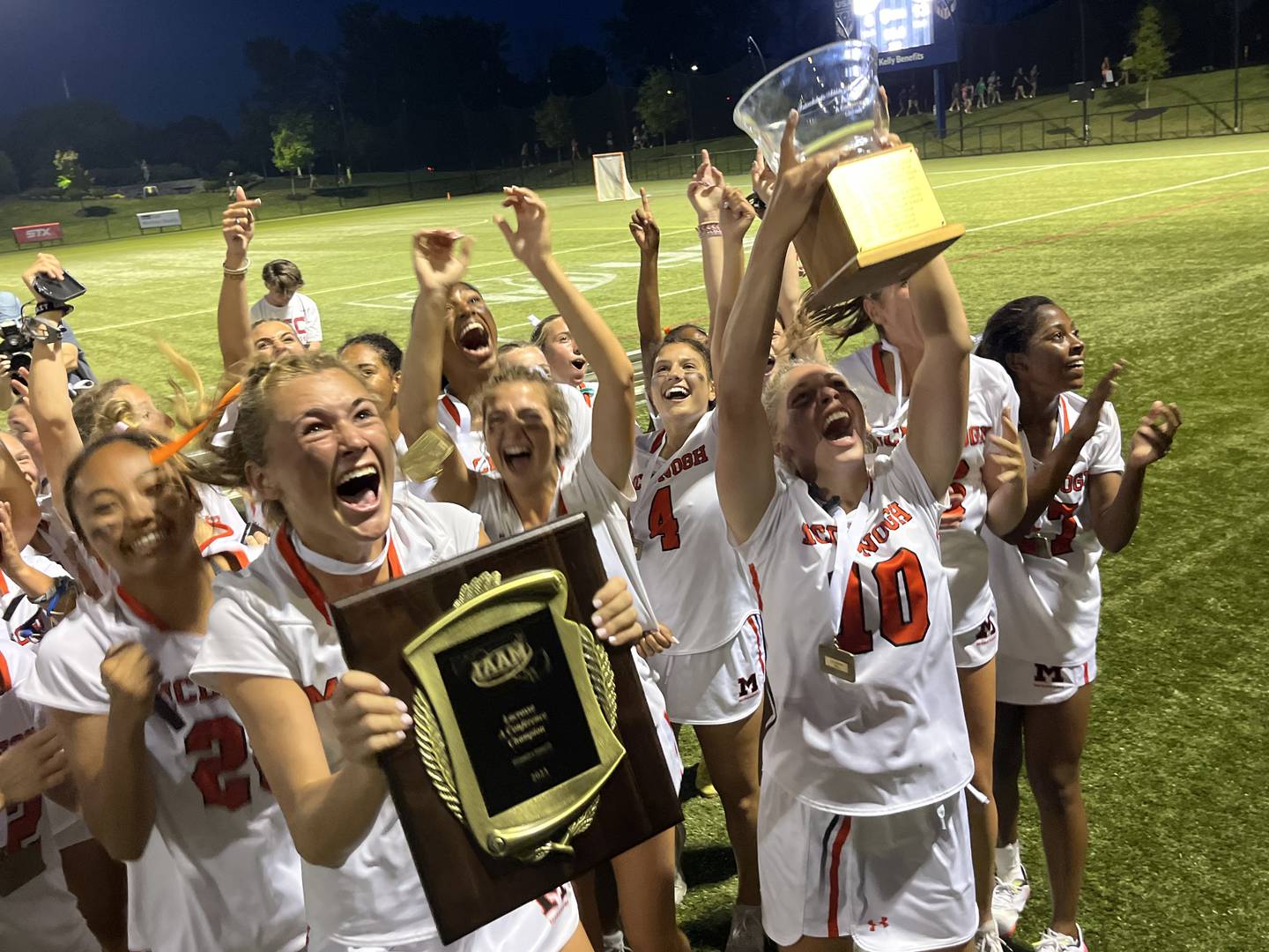 McDonogh's lacrosse team proudly show the IAAM A Conference championship plaque and trophy their fans. The Eagles won their first title since 2019 with a 13-8 dedicion over No. 2 St. Paul's at the USA Lacrosse Complex in Sparks.